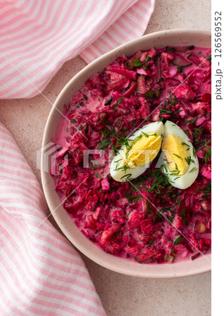 Summer cold beetroot soup made from beets, radishes, cucumbers, potatoes and herbs 126569552