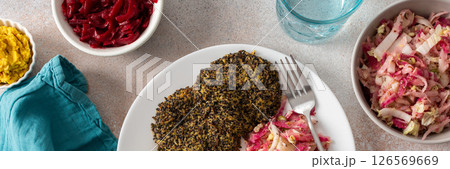 A well-balanced, wholesome breakfast made with quinoa pancakes, fresh greens, radishes, mung bean sprouts, eggs, hummus, and beets, offering protein, fiber, and energy, banner A well-balanced, wholesome breakfast made with quinoa pancakes, fresh greens, radishes, mung bean sprouts, eggs, hummus, and beets, offering protein, fiber, and energy, banner 126569669