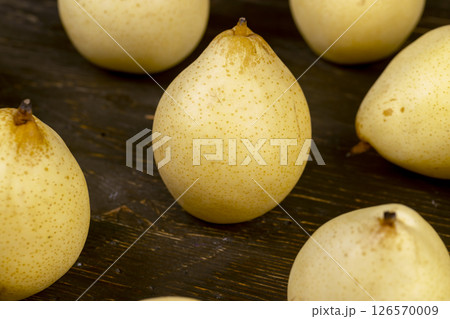 sweet pears of white color with spots on the skin closeup 126570009