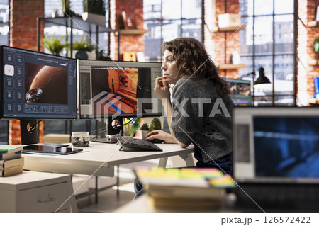 Woman using an AI chatbot interface to generate video game spaceship environments, modern system applies deep learning and machine learning techniques. Developing sci fi gaming designs. 126572422