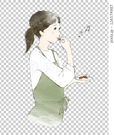 家事の合間にお菓子をつまむエプロン姿の女性 126574987