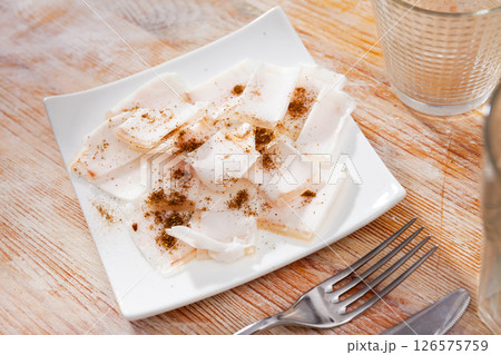 Delicious lard on a plate, cut into pieces 126575759