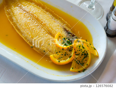 Dover sole cooked with orange 126576082