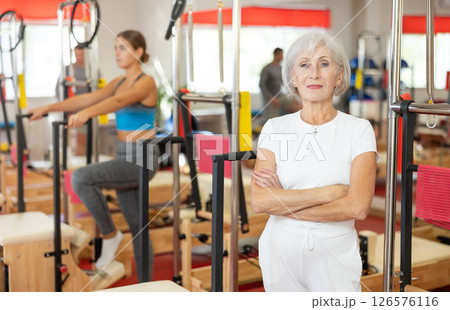 Elderly woman posing in pilates studio 126576116