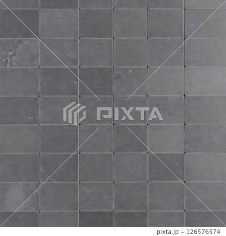 Many uniform dark gray square tiles are arranged with thin grout lines 126576574