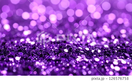 Bright glowing purple and pink Christmas bokeh circles sparkle on an abstract, festive holiday background 126576758
