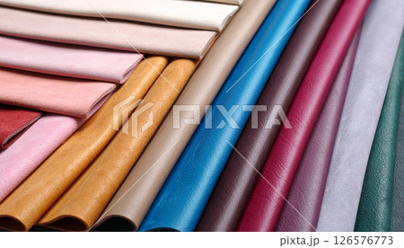 A rainbow stack of colorful plastic pipes and straws forms a vibrant textile-like pattern 126576773