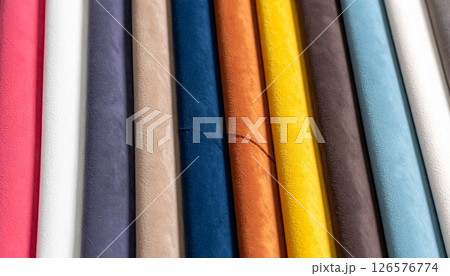 A rainbow stack of colorful plastic pipes and straws forms a vibrant textile-like pattern A rainbow stack of colorful plastic pipes and straws forms a vibrant textile-like pattern 126576774