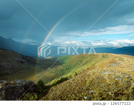 Two beautiful rainbow after the rain on high altitude mountain top Two beautiful rainbow after the rain on high altitude mountain top 126577122