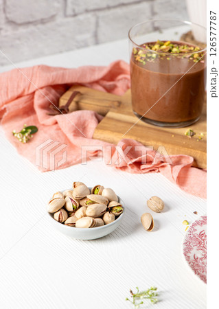Bowl of pistachios and chocolate mousse Bowl of pistachios and chocolate mousse 126577787