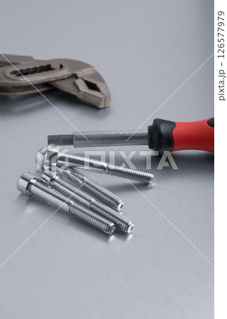 Spanner tool and screws 126577979
