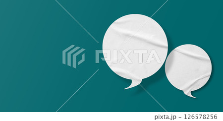 White speech bubble crumpled paper isolated on green background 126578256