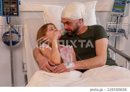A Heartwarming Scene of Father and Daughter Bonding in a Hospital Setting Full of Care A Heartwarming Scene of Father and Daughter Bonding in a Hospital Setting Full of Care 126580688