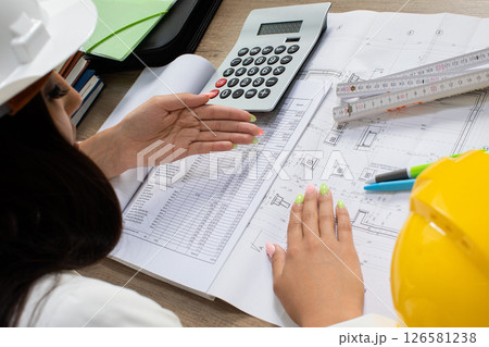 The Engineering Team is Collaborating on Detailed Project Plans and Calculations Effectively The Engineering Team is Collaborating on Detailed Project Plans and Calculations Effectively 126581238