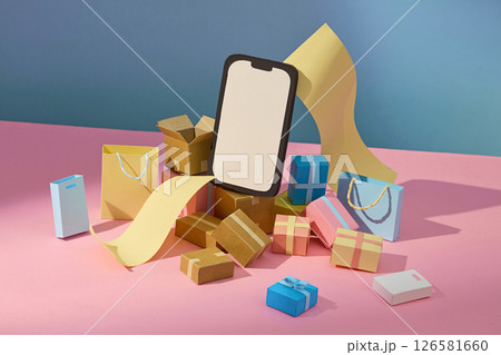 A smart phone prop surrounded by shopping bags, packages, and a long receipt scroll is arranged on pastel pink and teal paper, reflecting a busy online checkout. Blank space for text and design A smart phone prop surrounded by shopping bags, packages, and a long receipt scroll is arranged on pastel pink and teal paper, reflecting a busy online checkout. Blank space for text and design 126581660