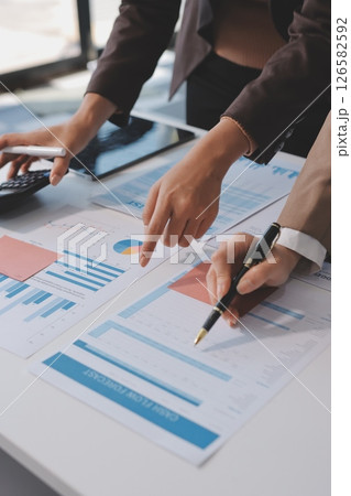 Accounting company provide finance and taxation planning for profitable cash flow, Auditor and accountant team working in office, analyze financial data and accounting record with calculator.Insight 126582592