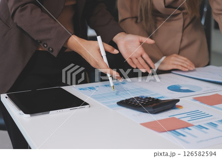 Accounting company provide finance and taxation planning for profitable cash flow, Auditor and accountant team working in office, analyze financial data and accounting record with calculator.Insight Accounting company provide finance and taxation planning for profitable cash flow, Auditor and accountant team working in office, analyze financial data and accounting record with calculator.Insight 126582594