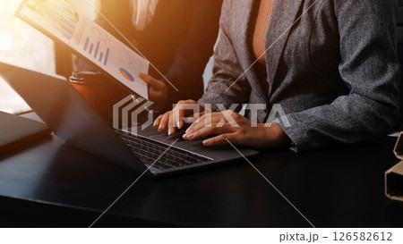 Accounting company provide finance and taxation planning for profitable cash flow, Auditor and accountant team working in office, analyze financial data and accounting record with calculator.Insight Accounting company provide finance and taxation planning for profitable cash flow, Auditor and accountant team working in office, analyze financial data and accounting record with calculator.Insight 126582612