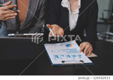 Accounting company provide finance and taxation planning for profitable cash flow, Auditor and accountant team working in office, analyze financial data and accounting record with calculator.Insight 126582613