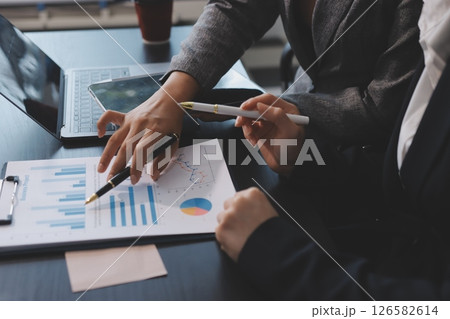 Accounting company provide finance and taxation planning for profitable cash flow, Auditor and accountant team working in office, analyze financial data and accounting record with calculator.Insight Accounting company provide finance and taxation planning for profitable cash flow, Auditor and accountant team working in office, analyze financial data and accounting record with calculator.Insight 126582614