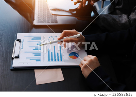 Accounting company provide finance and taxation planning for profitable cash flow, Auditor and accountant team working in office, analyze financial data and accounting record with calculator.Insight Accounting company provide finance and taxation planning for profitable cash flow, Auditor and accountant team working in office, analyze financial data and accounting record with calculator.Insight 126582615