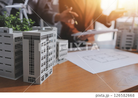 Discussion among businesspeople on the latest developments in solar cell panel technology and Solar Energy Environment city Concept. 126582668
