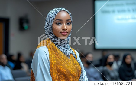 Stylish Woman in a Printed Hijab at a Conference 126582721