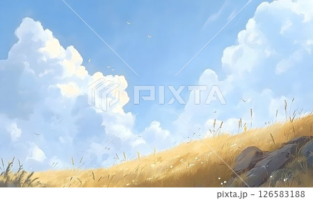 Golden Grassland Under a Bright Blue Sky with Puffy Clouds 126583188