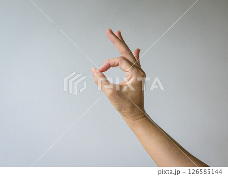Female hand in OK gesture. 126585144