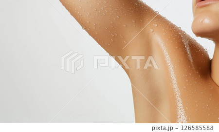 Woman showing smooth perfect armpit with water drops after shower 126585588