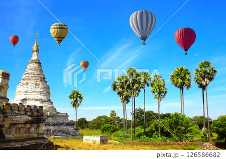 Balloon flight, famous tourist attraction of Bagan, Myanmar. Air balloons and ancient stupas in archaeological zone, Bagan, Burma. Topic of vacation, travel, trip abroad on vacation, cruises and tours 126586682