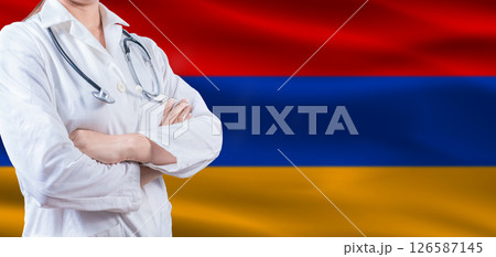Doctor with crossed arms on Armenia flag. Armenia health and care concept. Female doctor on Armenia flag Doctor with crossed arms on Armenia flag. Armenia health and care concept. Female doctor on Armenia flag 126587145