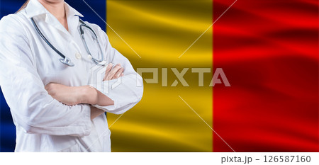 Doctor with crossed arms on Romanian flag. Romania health and care concept. Female doctor on Romanian flag Doctor with crossed arms on Romanian flag. Romania health and care concept. Female doctor on Romanian flag 126587160