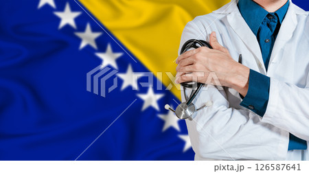 Doctor with stethoscope on Bosnia flag. Doctor holding stethoscope on Bosnia flag 126587641