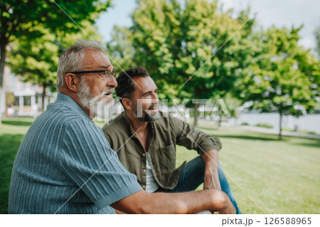 Senior dad and middle-aged son enjoying nature together Senior dad and middle-aged son enjoying nature together 126588965