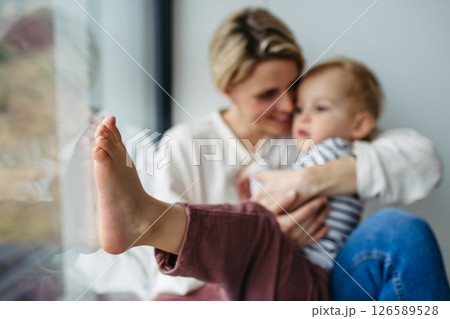 Beautiful mother hugging little son, 126589528