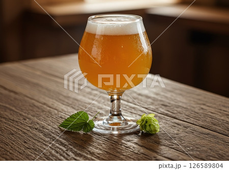 Beer in tulip glass with hop and leaf 126589804