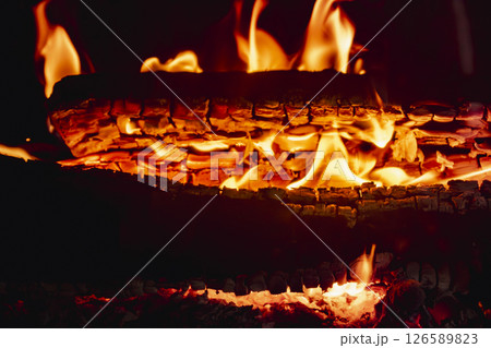 Fire in a fireplace in the living room 126589823