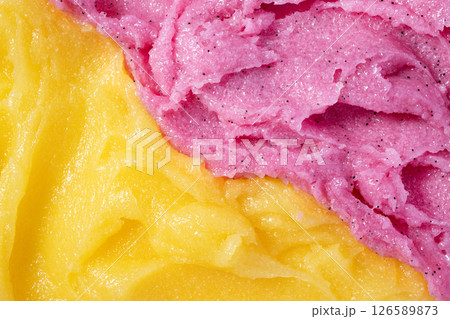Raspberry and melon fruit scrub texture. Bright pink and yellow creamy smear with exfoliating crystals. Organic cosmetic body care peeling. Natural skincare exfoliating scrubber treatment. Raspberry and melon fruit scrub texture. Bright pink and yellow creamy smear with exfoliating crystals. Organic cosmetic body care peeling. Natural skincare exfoliating scrubber treatment. 126589873