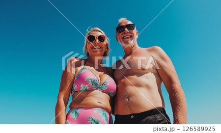 Happy senior couples enjoying a sunny day at the beach 126589925