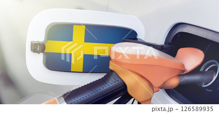 The Sweden flag on the lid of the gas tank of a car at a gas station in close-up. High or low gasoline prices at Swedish gas stations. Gasoline prices are rising due to a shortage of diesel fuel 126589935