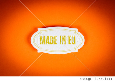 Made in EU Label Concept on Orange Background Representing European Manufacturing and Product Origin Made in EU Label Concept on Orange Background Representing European Manufacturing and Product Origin 126591434