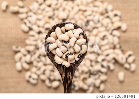 Black-eyed pea or cowpea in wooden spoon, Food ingredient, Top view Black-eyed pea or cowpea in wooden spoon, Food ingredient, Top view 126591491