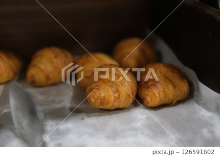 fresh mini croissants, rotation in circle. close up of french croissant,  126591802