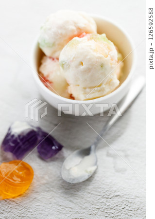 Milk yogurt and jelly ice cream in a white bowl. 126592588