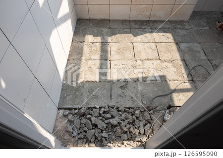 Tile and concrete floor reconstruction. Tile and concrete floor reconstruction. 126595090