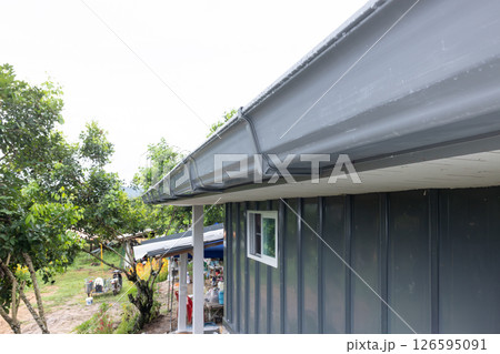 Roof gutter or rain gutter in perspective view. 126595091
