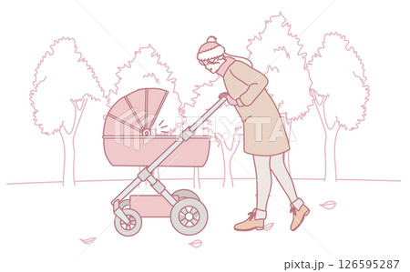A woman is pushing a baby stroller in the beautiful park while enjoying the outdoors A woman is pushing a baby stroller in the beautiful park while enjoying the outdoors 126595287