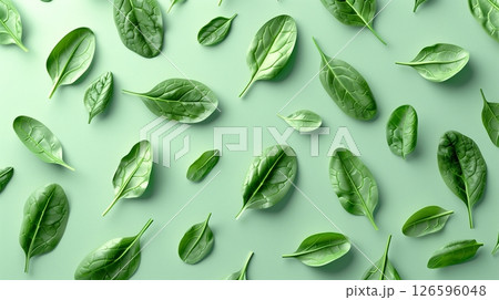 Spinach leaves organic botanical pattern on green background 126596048