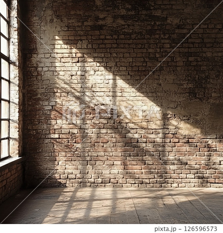 Collection of empty, rustic room interiors featuring weathered brick walls and atmospheric light. 126596573